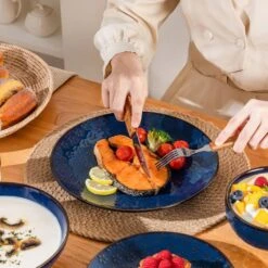 16-Piece Blue Stoneware Dinnerware Set Service For 4-Embossed Star-shape Floral Pattern Bowls And Plates Set 17 16-Piece Blue Stoneware Dinnerware Set Service For 4-Embossed Star-shape Floral Pattern Bowls And Plates Set -Vancasso Shop blue vancasso dinnerware sets lydia sl b 01 66 1000