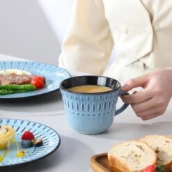 16-Piece Blue Porcelain Dinnerware Set Service For 4-Embossed Pattern Tableware With Dinner Plate Dessert Plate Bowl Mug 26 16-Piece Blue Porcelain Dinnerware Set Service For 4-Embossed Pattern Tableware With Dinner Plate Dessert Plate Bowl Mug -Vancasso Shop blue vancasso dinnerware sets nile b sl d4 1000