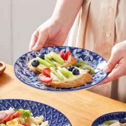 16-Piece Blue Porcelain Dinnerware Set Service For 4 Dinner Set With Dinner Plates Dessert Plates Cereal Bowls And Mugs 32 16-Piece Blue Porcelain Dinnerware Set Service For 4 Dinner Set With Dinner Plates Dessert Plates Cereal Bowls And Mugs -Vancasso Shop blue vancasso dinnerware sets vc selene 16b 31 1000