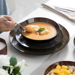 16-Piece Brown Stoneware Dinnerware Set Service For 4 Tableware Set With Plates Bowls And Mugs 21 16-Piece Brown Stoneware Dinnerware Set Service For 4 Tableware Set With Plates Bowls And Mugs -Vancasso Shop brown vancasso dinnerware sets vc bubble bn sl 44 1000