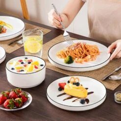 18-Piece White Black Rim Porcelain Dinnerware Set Service For 6 Tableware With Dinner Plates Dessert Plates And Bowls 25 18-Piece White Black Rim Porcelain Dinnerware Set Service For 6 Tableware With Dinner Plates Dessert Plates And Bowls -Vancasso Shop white black rim vancasso dinnerware sets leah 18 bt 31 1000